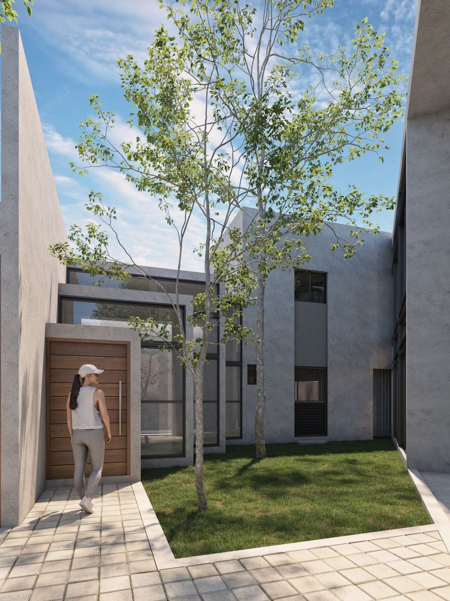 Casa Zen, acceso entre muros blancos y árboles